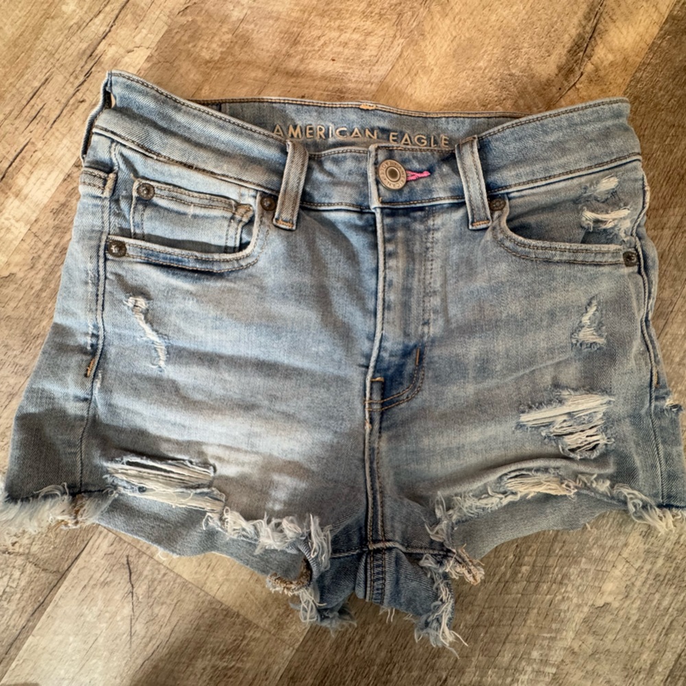American Eagle next level stretch  size 2 blue denim shorts with distressed look